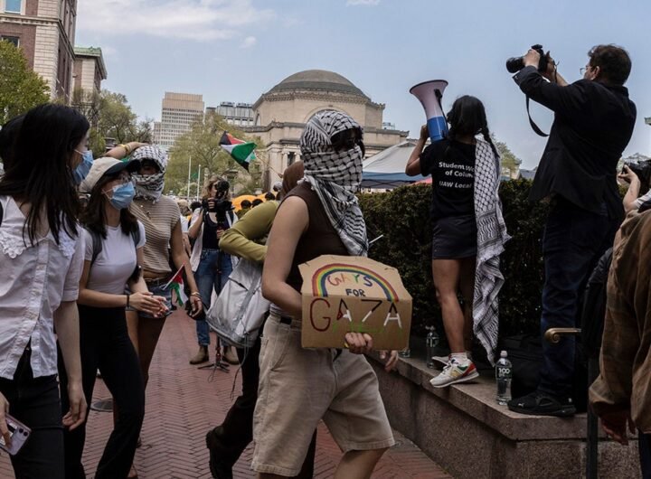 Student protesters march around their encampment on the Columbia University campus