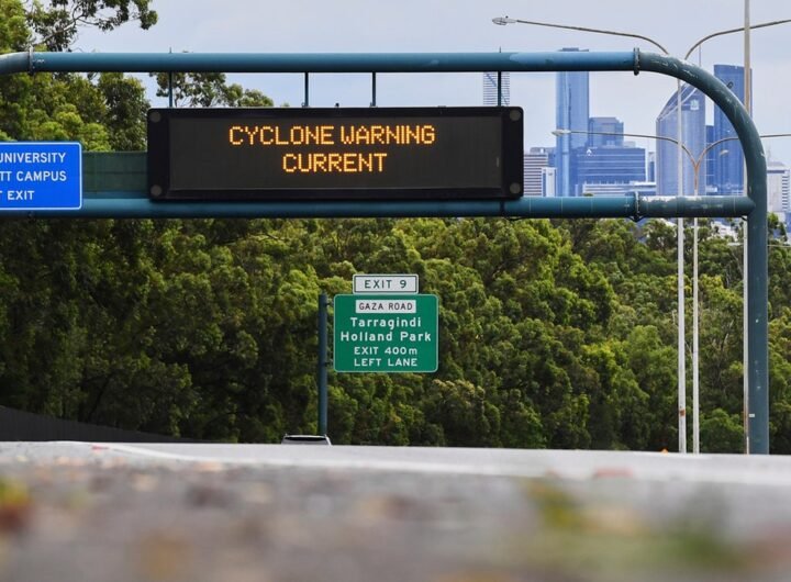 "CYCLONE WARNING CURRENT" sign